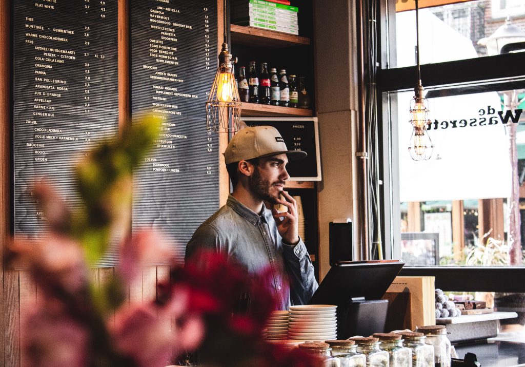 A man standing behind a counter