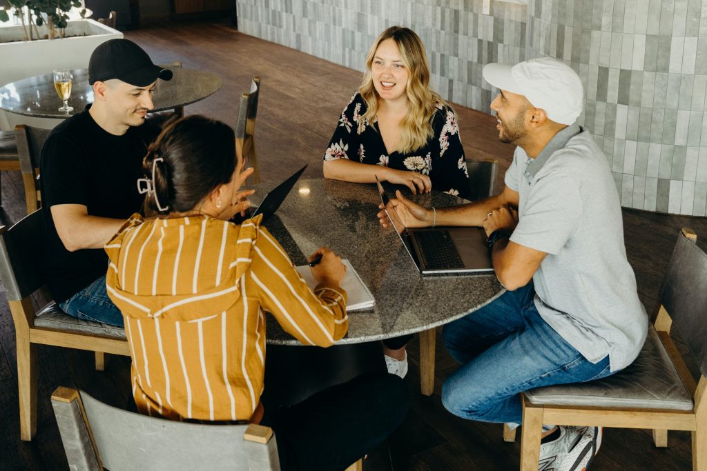 A group of people sitting around a table