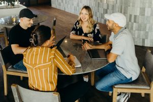 A group of people sitting around a table