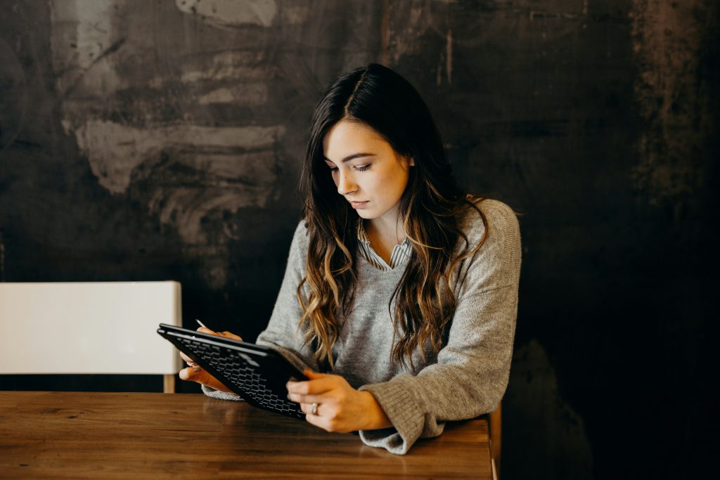 Woman browsing on a laptop