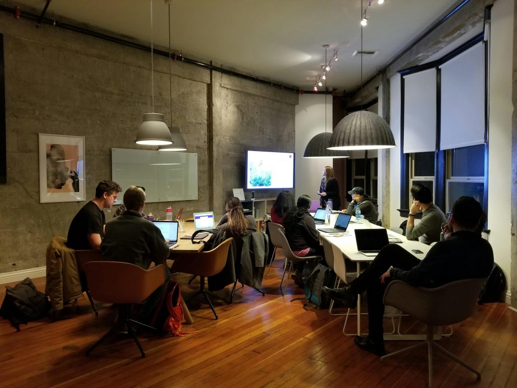 People sitting on chairs in an office