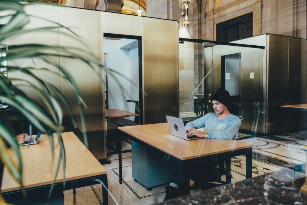 Man  using grey laptop